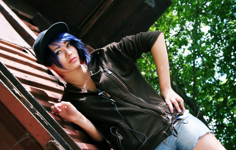 person with blue hair leaning