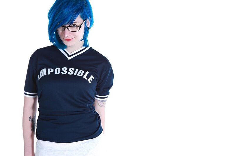person with blue hair wearing t-shirt