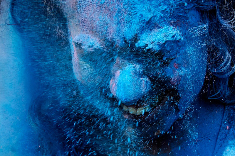 person with blue powder on face
