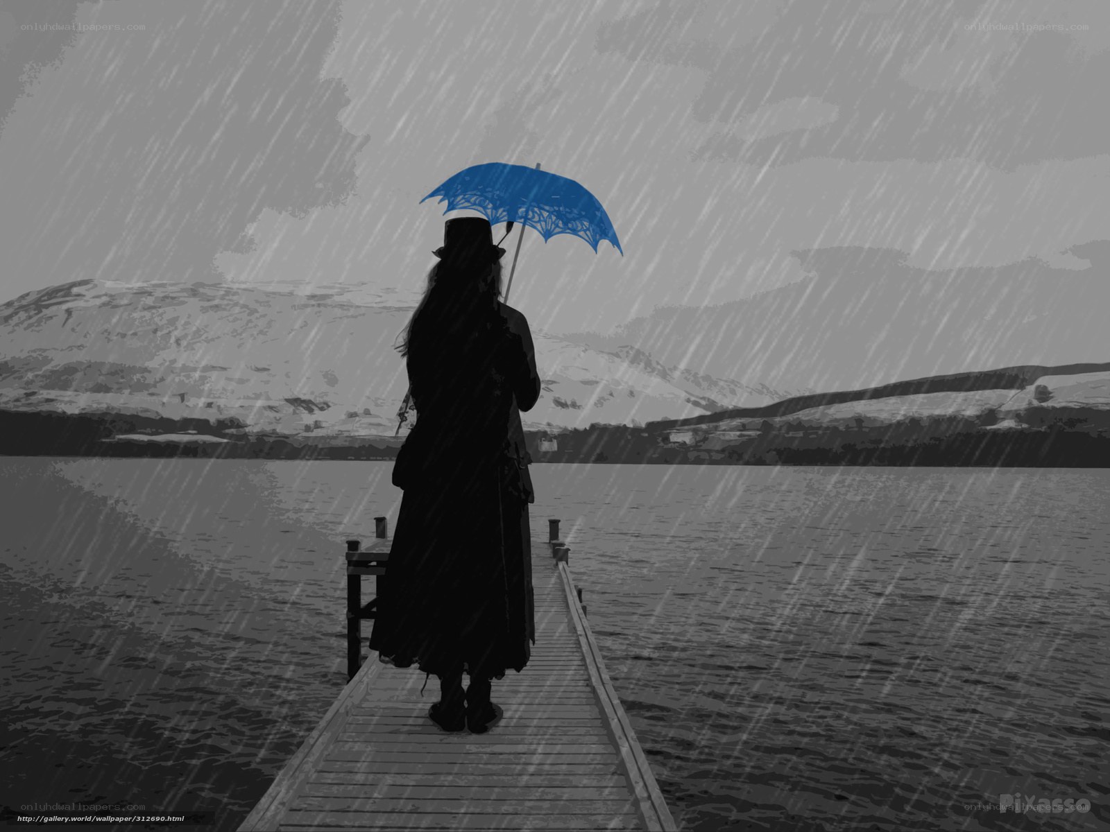 person with blue umbrella in rain