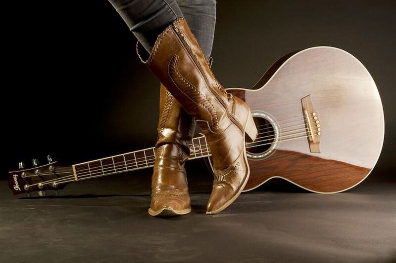 Person with Boots and Guitar
