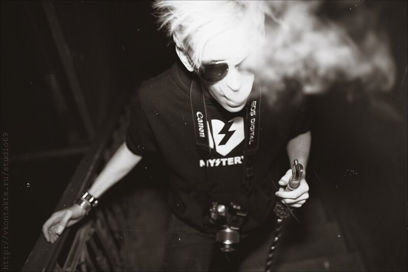 person with camera and vape