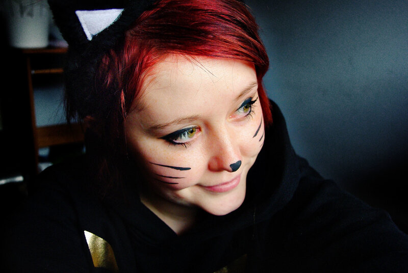person with cat makeup