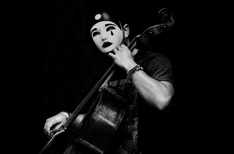 Person with Cello and Mask