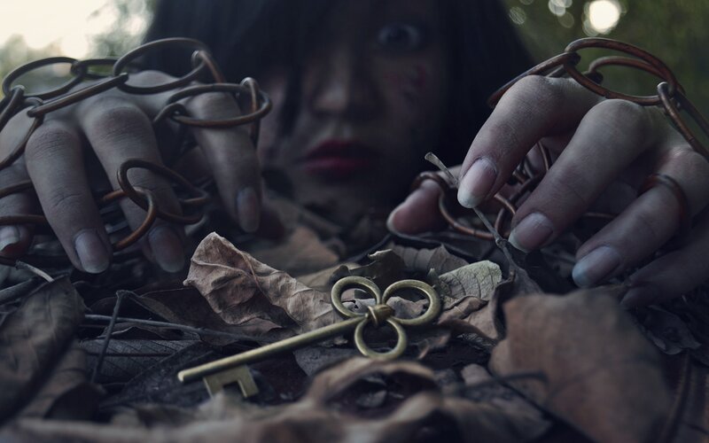 Person with Chains and Key