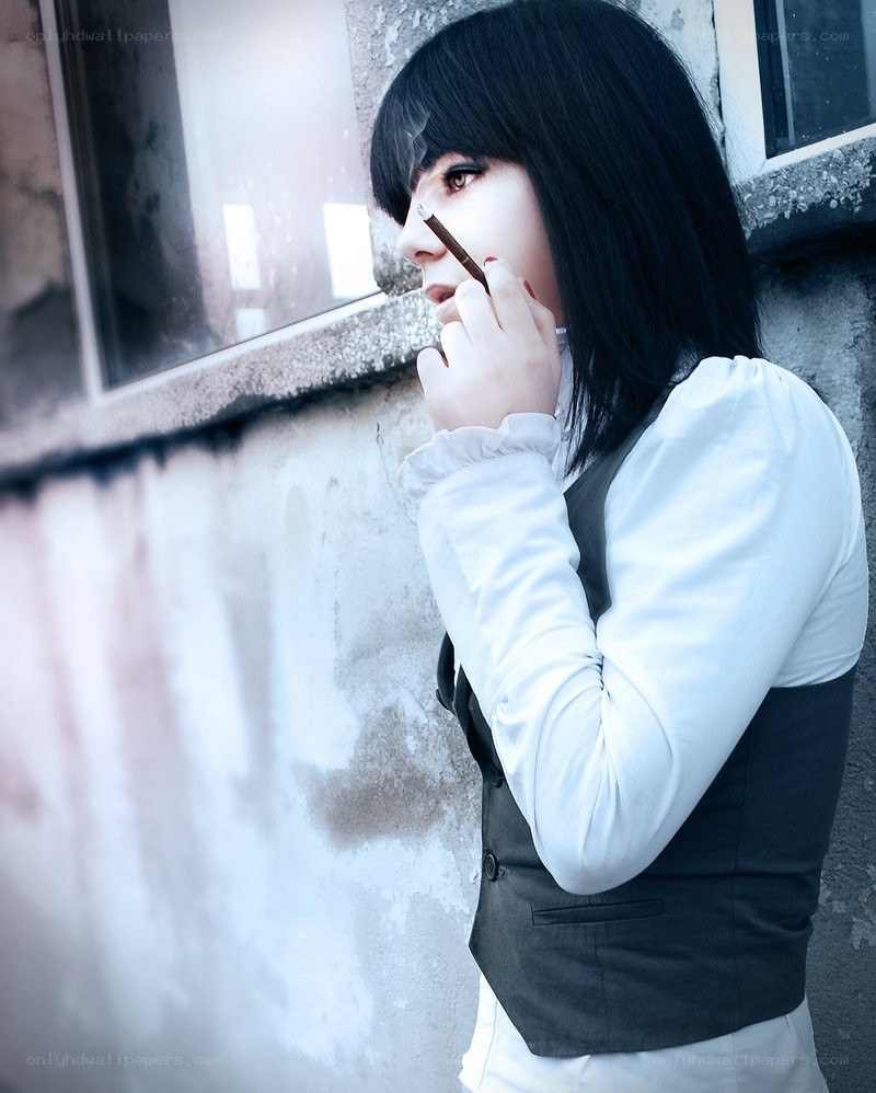 person with cigarette near window