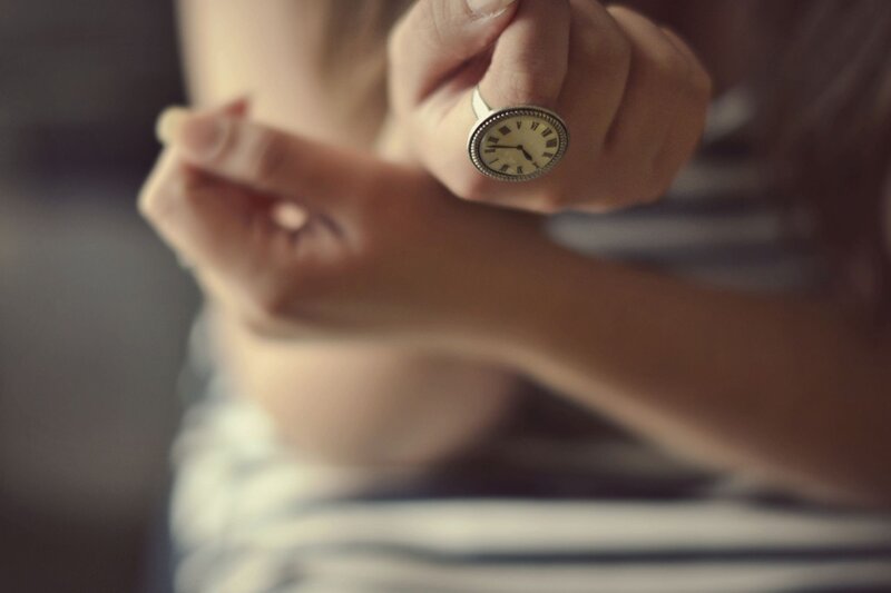 person with clock ring