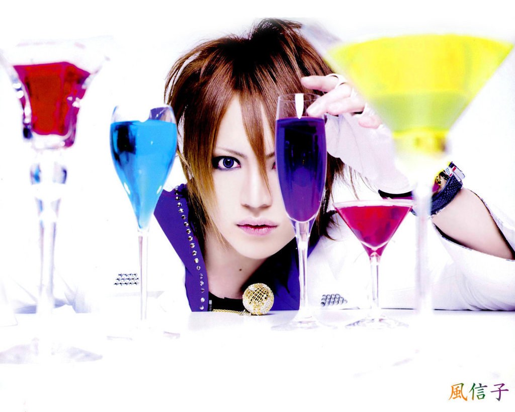 person with colorful drinks
