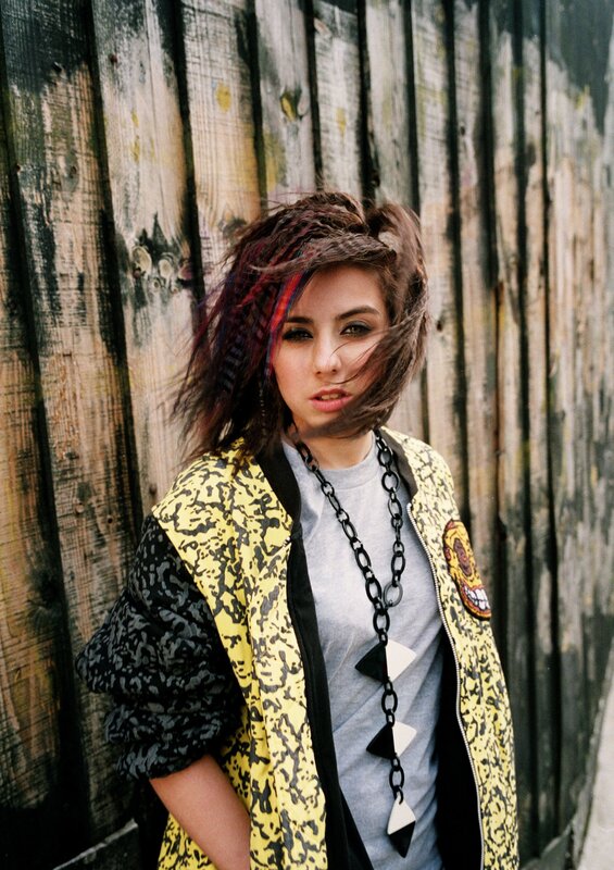 person with colorful hair and jacket