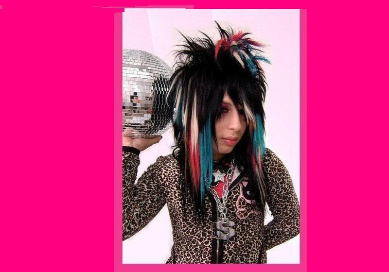 person with colorful hair and leopard jacket