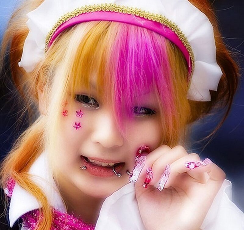 person with colorful hair and makeup