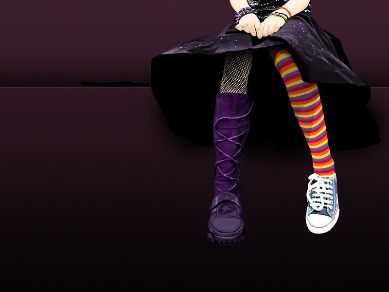 person with colorful socks and boots