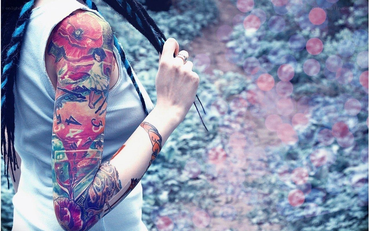 person with colorful tattoos