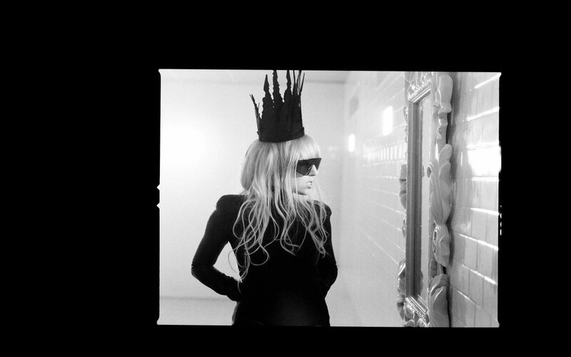 person with crown and sunglasses