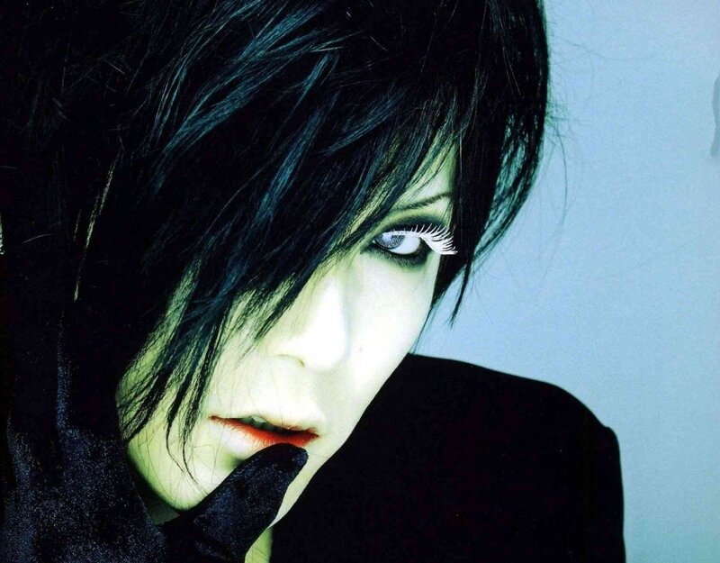 person with dark hair and makeup