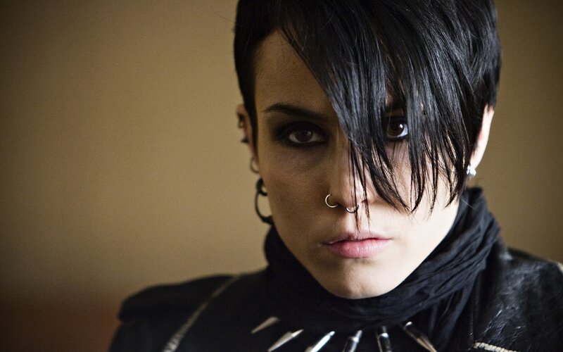 person with dark hair and piercings