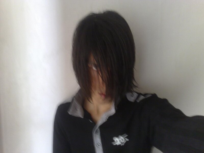 person with dark hair taking selfie