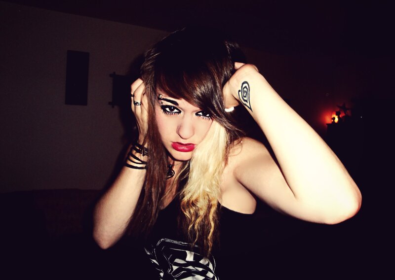 person with dark makeup and hair