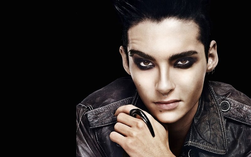 person with dark makeup and leather jacket