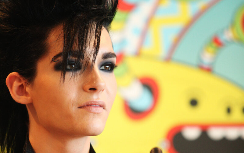 person with dark makeup and spiky hair