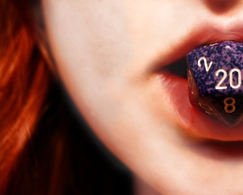 person with dice in mouth