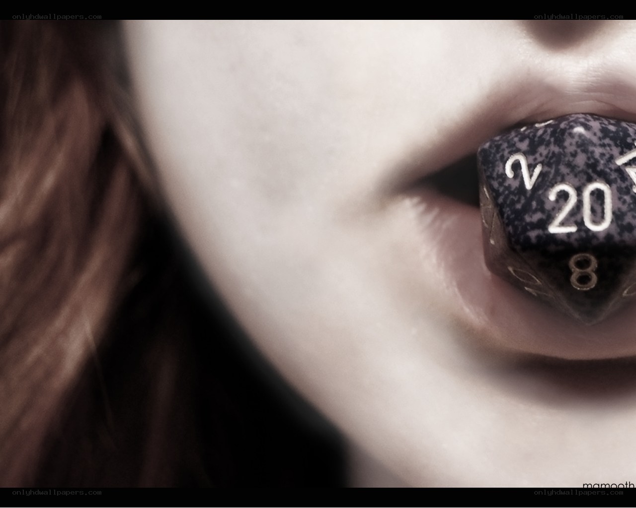 person with dice in mouth