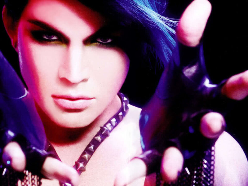 person with dramatic makeup and blue hair