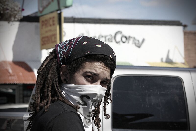 person with dreadlocks and bandana