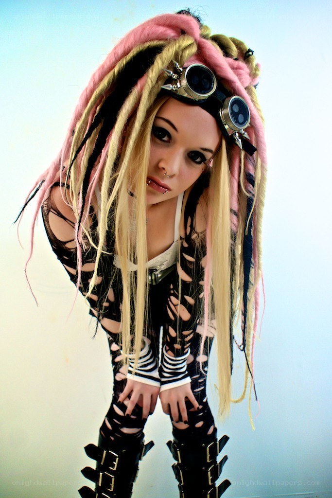 person with dreadlocks and goggles