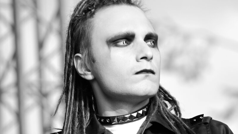 person with dreadlocks and makeup