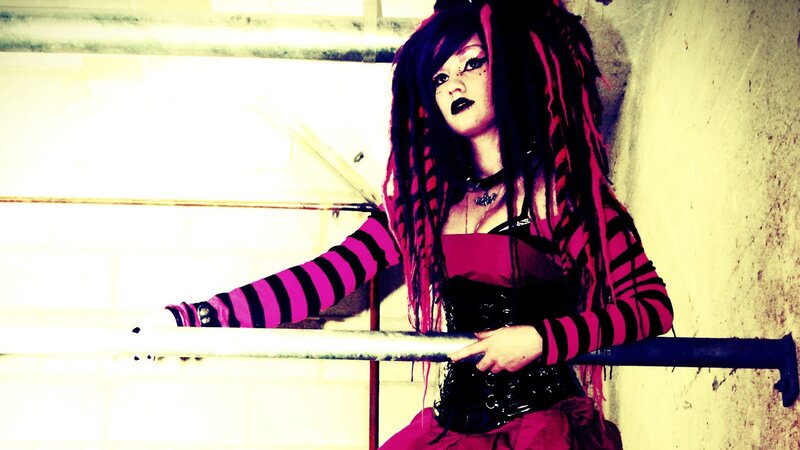 person with dreadlocks and striped shirt
