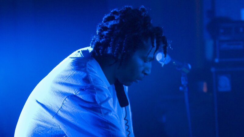 Person with Dreadlocks on Stage