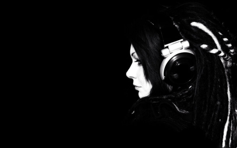 person with dreadlocks wearing headphones