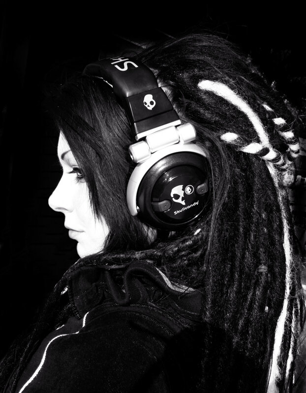 person with dreadlocks wearing headphones