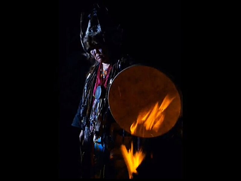 Person with Drum and Fire
