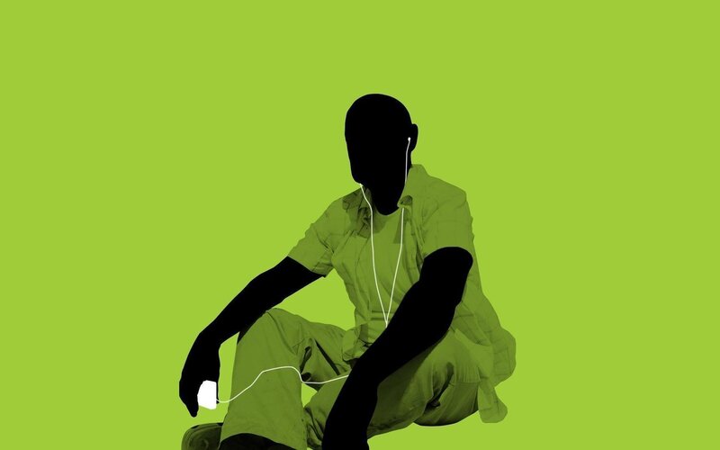 person with earphones on green background
