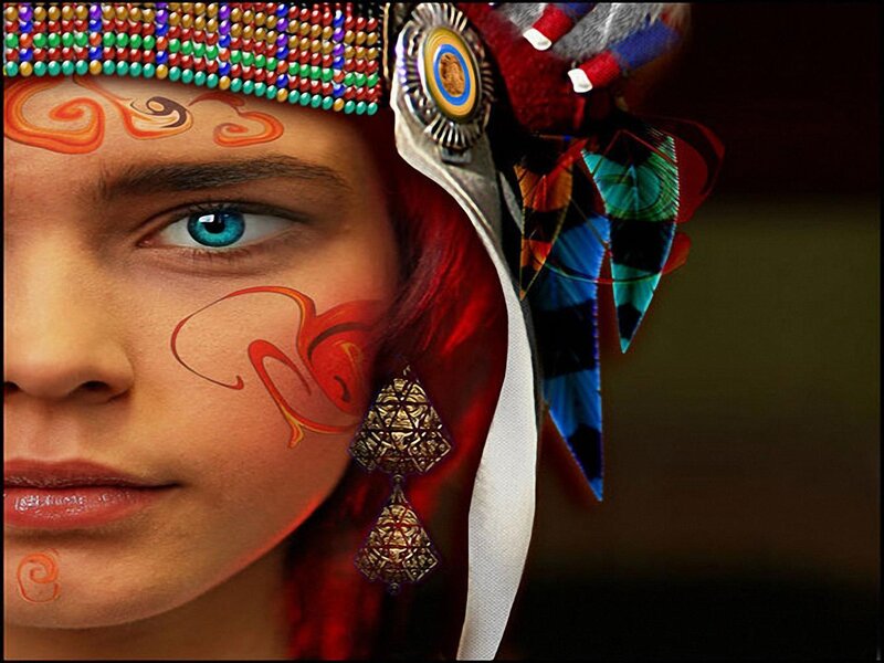 person with face paint and headdress