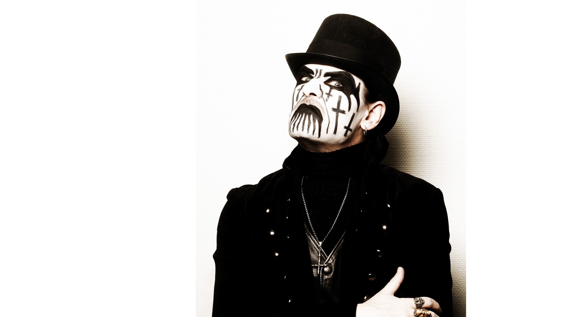 person with face paint and top hat