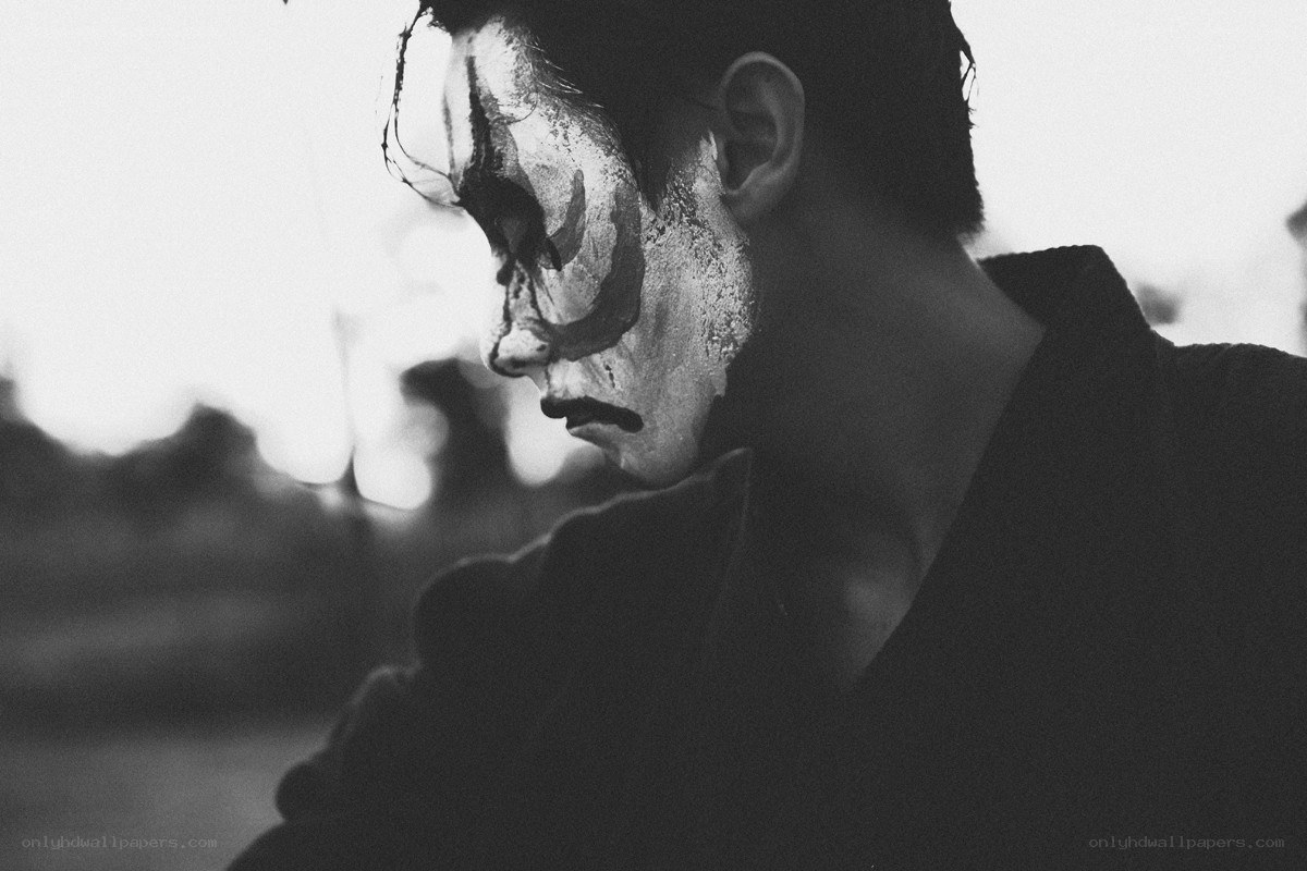 person with face paint in profile