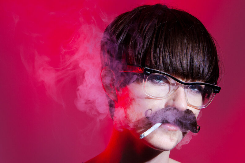 person with fake mustache and glasses