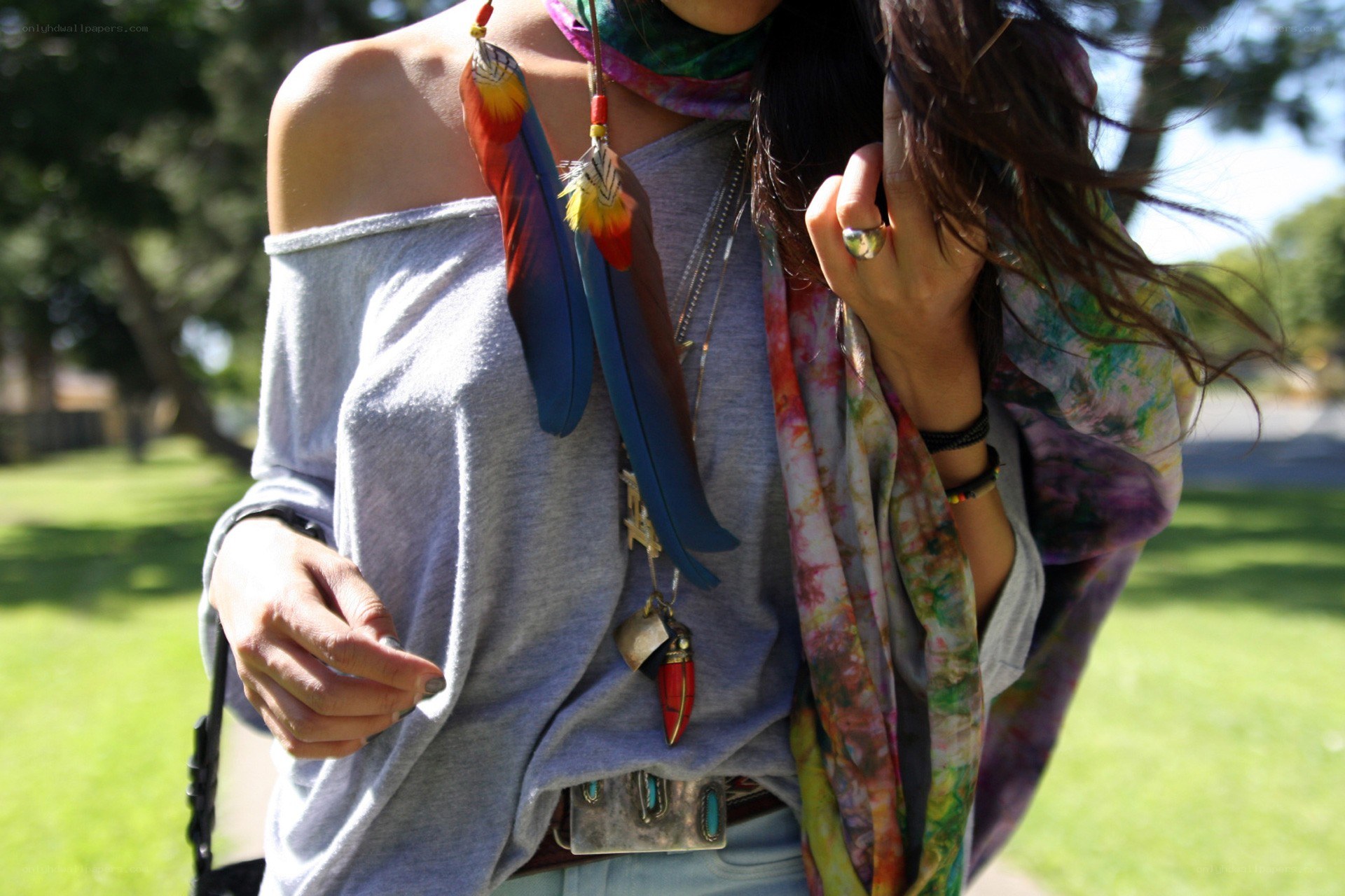 person with feather necklace