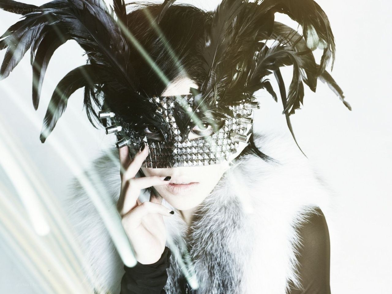 person with feathered mask