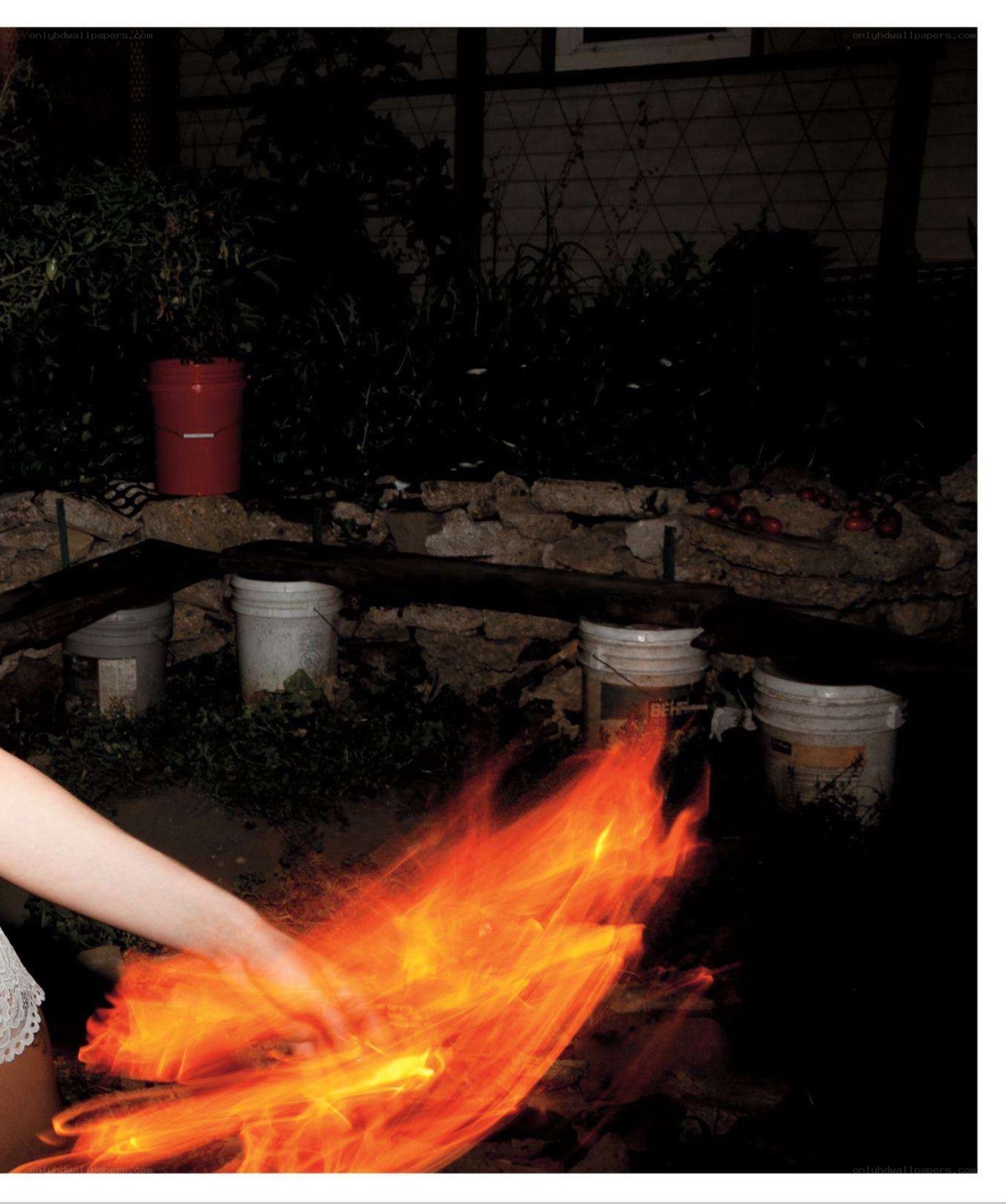 person with fire in garden