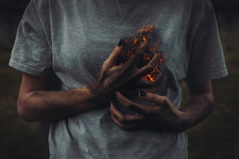 person with fire on chest