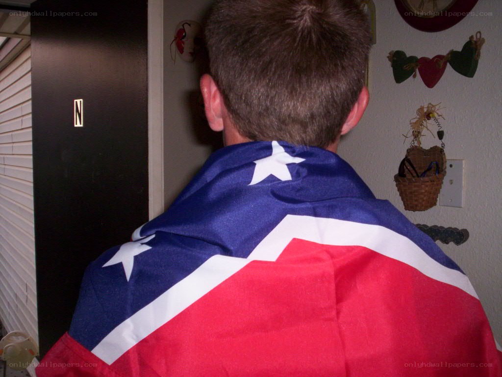 person with flag draped over shoulders