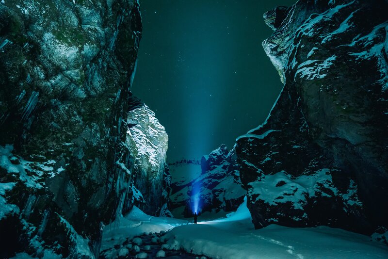 Person with Flashlight in Canyon — Blue, Dramatic