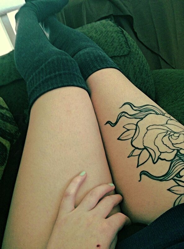 person with floral tattoo