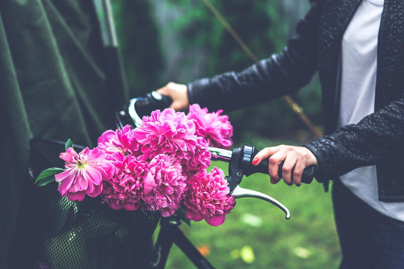 person with flowers on bike