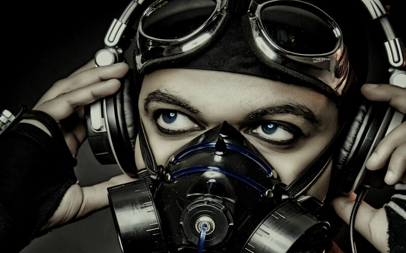 person with gas mask and headphones