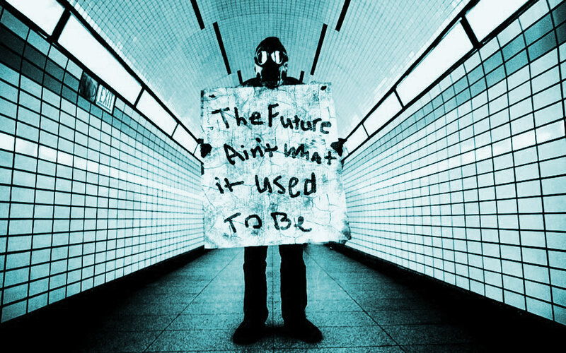 person with gas mask holding sign